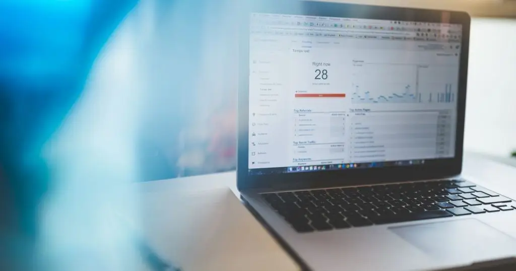 Laptop displaying Google Analytics in a modern workspace